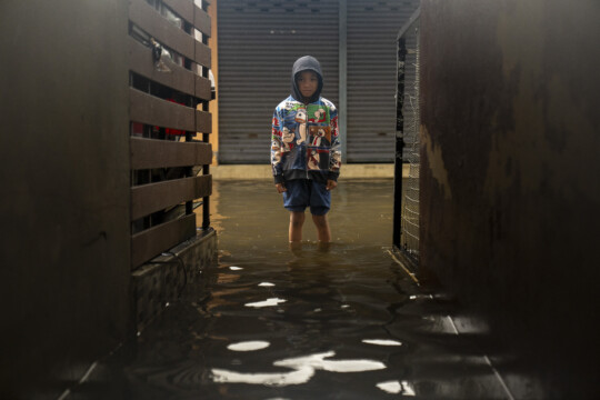 A boy walking in floodwaters in Pattani Province. Children are often the most vulnerable in an emergency, which is why UNICEF makes supporting them our top priority.